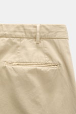 Close-up rear view of the Santaniello Anzug sand trousers in soft pure cotton twill, showing slim fit and welt pocket details.