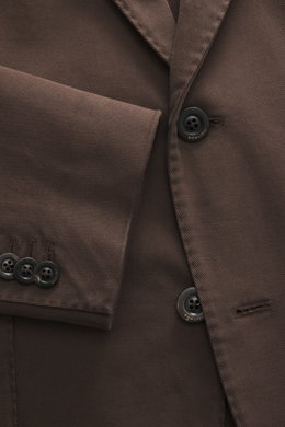 Close-up view of the Boglioli Blazer 'K. Jacket' grey brown showing the fabric texture and buttons, made of stretch cotton twill, slim fit, two-button style, notched lapel, classic breast pocket, patch hip pockets, kissing buttons, rear side vents, uncons