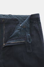 A close-up front view of navy blue trousers with an open zipper and button, showing detailed stitching and fabric texture. Practical for the next business trip: With the uncomplicated and super lightweight unconstructed blazer "K. Jacket" from BOGLIOLI ma