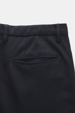 Close-up rear view of trousers from the Boglioli Suit 'K. Jacket' dark navy, made of lightweight virgin wool twill, slim fit with welted back pocket.