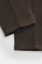 Close-up front view of the sleeve and pant leg of the Boglioli Corduroy Suit 'K. Jacket' grey brown, showcasing slim fit, soft touch corduroy fabric made from a slightly elastic cotton and modal blend, practical for business trips with tailored two-button