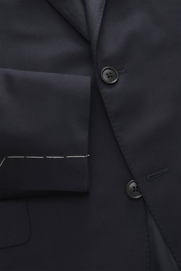 Close-up front view of Belvest Suit navy jacket showing pure super 150's wool fabric with soft feel, slim fit, tailored two-button style, notched lapel with pin, classic breast pocket, hip pockets with flap, unfinished sleeve cuffs, and smooth lining fabr