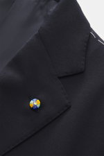 Close-up angled view of Belvest Suit navy jacket lapel made from pure super 150'S wool with soft feel, slim fit, tailored two-button style, notched lapel with pin, classic breast pocket, hip pockets with flap, unfinished sleeve cuffs, smooth lining fabric