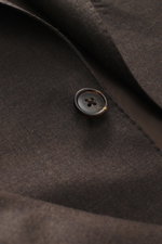 Belvest Suit grey brown melange fabric close-up from above showing pure super 150'S wool, soft feel, slim fit, tailored two-button jacket with notched lapel and button detail.
