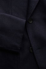 Close-up front view of the Stile Latino Suit 'Andrea' navy melange jacket, showing fine Prince-of-Wales pattern, button, and soft wool-cashmere texture.
