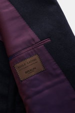 Close-up view of the Stile Latino Suit 'Andrea' navy melange showing dark wool-cashmere fabric with subtle Prince-of-Wales pattern and purple striped inner lining with label.

(Note: The alt tag is limited to 125 characters for accessibility and SEO best 