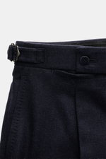Close-up front view of the waistband of the Stile Latino Suit 'Andrea' navy melange trousers, featuring a button fly and retro-style side adjusters.