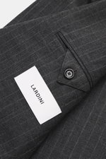Close-up of Lardini Anthracite striped suit fabric and cuff, showing pure new wool texture, subtle check pattern, button detail, and label, photographed from above.