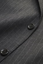 Close-up front view of the Lardini Anthracite striped suit showing pure new wool fabric with subtle check pattern, slim fit, two black buttons, and lightly textured feel.