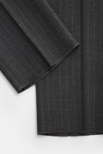 Close-up front view of fabric details of the Lardini Anthracite striped suit in pure new wool with a subtle check pattern and lightly textured feel.