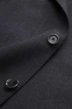 Close-up front view of the Lardini Suit dark navy melange showing pure new wool fabric with subtle check pattern and black buttons.