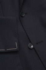 Close-up front detail of the Tagliatore Suit 'Vesuvio' dark navy, showing the double-breasted jacket's buttons and virgin wool cashmere fabric.