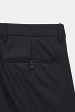 Dark navy trousers of the Tagliatore Suit 'Vesuvio' shown from the rear top, slim fit blend of virgin wool and cashmere with buttoned back pocket.