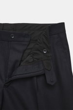 Close-up front view of the Tagliatore Suit 'Vesuvio' dark navy trousers showing virgin wool and cashmere blend, zipper, button, and waistband details.