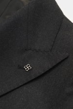 Close-up front angle of the Tagliatore Suit 'Vesuvio' anthracite melange lapel showing fine virgin wool and cashmere blend fabric with a silver pin.