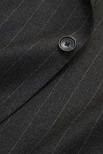 Close-up front view of the Tagliatore Suit 'Vesuvio' anthracite striped lapel, showcasing soft Super 110's virgin wool with chalk stripes and button.
