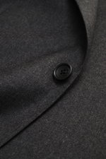 Close-up front view of the Tagliatore Suit 'Vesuvio' dark grey melange showing soft Super 120's virgin wool fabric and black button detail.