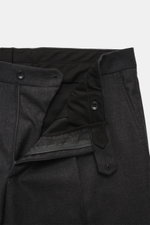 Close-up front view of the Tagliatore Suit 'Vesuvio' dark grey melange trousers showing zipper, button, and waistband details in soft Super 120's virgin wool.
