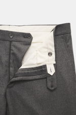 Close-up front view of the Tagliatore Suit 'Vesuvio' grey melange trousers showcasing the zipper, button, and white inner lining made of Super 110's virgin wool with a slight stretch for comfort. Elegant silhouette with slim fit, tailored two-button jacke
