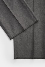 Close-up view of Tagliatore Suit 'Vesuvio' grey melange fabric showing soft Super 110's virgin wool with slight stretch and fine texture.
