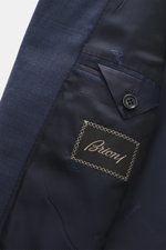 Close-up inside view of the Brioni Suit 'Brunico' navy melange showing pure wool smooth fabric and branded lining with buttoned inner pocket.