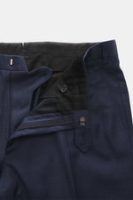 Close-up front view of the Brioni Suit 'Brunico' navy melange trousers, showcasing the zipper, waistband button, and fabric details.