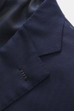 Close-up front angle of Brioni Suit 'Brunico' navy lapel, showcasing fine silk-wool blend fabric, tailored two-button style, notched lapel, and detailed stitching.