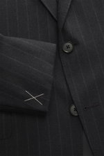 Close-up front view of Zegna Suit dark grey striped jacket showing elastic wool fabric, classic pinstripe pattern, tailored two-button style with notched lapel and black buttons.