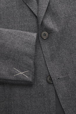 Close-up front view of the Zegna Suit grey melange jacket showing pure wool fabric with soft touch, slim fit, two-button style, notched lapel, and woven texture.