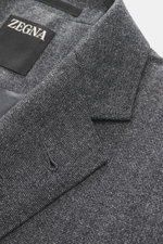 Close-up front angle of Zegna Suit grey melange jacket lapel showing distinctive woven texture and pure wool craftsmanship.