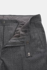Close-up front view of Zegna Suit grey melange trousers showing pure wool fabric, soft touch, slim fit, zipper, button, and distinctive woven texture.