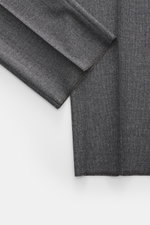 Close-up front view of the Zegna Suit grey melange sleeve and fabric texture, showcasing pure wool, slim fit, and distinctive woven design.