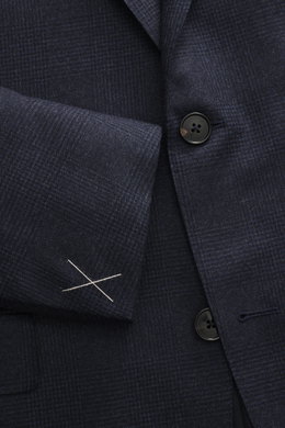 Close-up front view of Zegna Suit 'Trofeo' navy melange showcasing its subtle check pattern, pure wool fabric, and tailored two-button jacket with notched lapel and soft touch.
