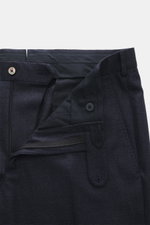 Zegna Suit 'Trofeo' navy melange trousers close-up from above showing zipper, button, waistband, subtle check pattern, and soft pure wool fabric.