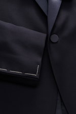 Close-up front view of the Tagliatore Tuxedo navy showing the slim fit, one-button jacket in pure Super 110'S virgin wool with satin lapel.