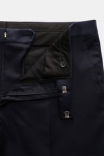 Close-up front view of the waist and fastening details of the Tagliatore Tuxedo navy trousers in pure Super 110'S virgin wool.
