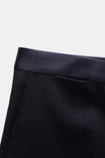 Navy satin waistband detail of Tagliatore Tuxedo navy trousers, photographed close-up from the top front angle.