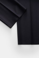Close-up front view of navy fabric details of the Tagliatore Tuxedo navy, showcasing pure Super 110'S virgin wool with a smooth feel and slim fit.