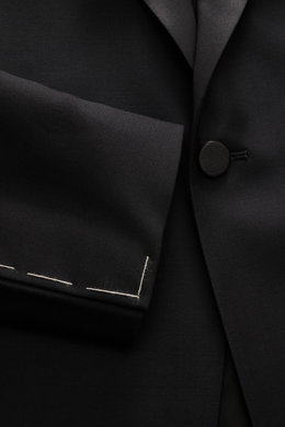 Close-up front view of Tagliatore Tuxedo black lapel and button in pure Super 110'S virgin wool with smooth feel, slim fit.