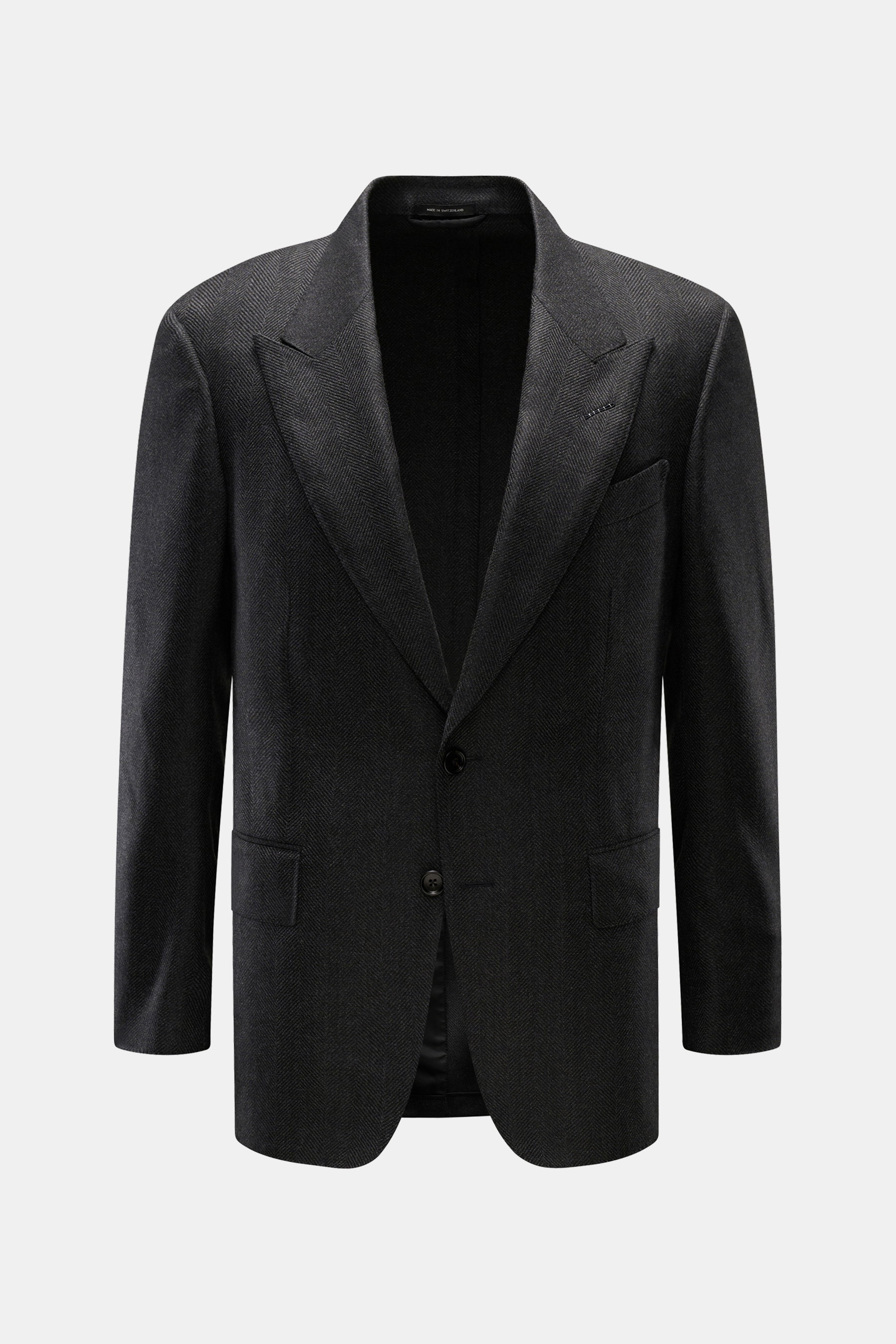 Tom Ford Sakko 'Shelton' dunkelgrau meliert, Slim Fit, tailliert mit tonalem Fischgrat, Spitzrevers, Zwei-Knopf-Stil, frontale Aufnahme.