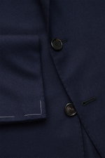 Close-up front view of the Cesare Attolini Cashmere smart-casual jacket navy showing soft pure cashmere fabric, slim fit, fitted three-button style, step lapel, classic breast pocket, patch hip pockets, unfinished sleeve cuffs, side vents, and fine stitch
