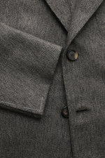 Close-up front view of Cesare Attolini Cashmere jacket grey mottled, showing button details and fabric texture.

<p>Enjoy luxury from CESARE ATTOLINI: This timeless smart-casual jacket is made in Italy from the finest pure cashmere – a masterpiece to take