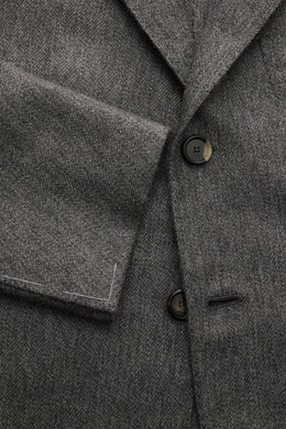 Close-up front view of Cesare Attolini Cashmere jacket grey mottled, showing button details and fabric texture.

<p>Enjoy luxury from CESARE ATTOLINI: This timeless smart-casual jacket is made in Italy from the finest pure cashmere – a masterpiece to take