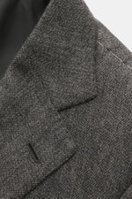 Close-up of the lapel and shoulder area of the Cesare Attolini Cashmere jacket grey mottled, showing the fine woven texture and precise stitching from a top-down perspective.

<p>Enjoy luxury from CESARE ATTOLINI: This timeless smart-casual jacket is made