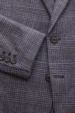 Close-up front-side view of Circolo 1901 Jersey smart-casual jacket anthracite/light grey checked, slim fit with step lapel, two-button style, and patch pockets. Jersey made of cotton and elastane with a soft feel, glen check print, cuffs with buttons, si