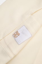 Marco Pescarolo Blazer 'Giove' creme Detailaufnahme des weichen Materials mit Woll-, Cashmere- und Seidengemisch, Etikett frontal sichtbar.