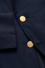 Close-up front view of the Belvest Smart-casual jacket navy showing its super soft cashmere-silk fabric, fine twill, slim fit, fitted three-button style with gold buttons, step lapel with pin, and unfinished sleeve cuffs. <p>BELVEST combines super soft fa