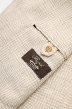 Close-up top-side view of the cream/beige checked Belvest Smart-casual jacket fabric and sleeve cuff with button and label, showing wool, linen, silk, and cashmere blend with typical glen check texture.

Description: <p>BELVEST has brought together the be