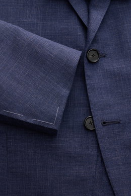 Close-up front view of the Cesare Attolini Smart-casual jacket navy mottled showing buttons, step lapel, and textured wool, silk, and linen blend fabric.

<p>Enjoy luxury from CESARE ATTOLINI: This timeless smart-casual jacket is exclusively made in Italy