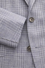 Close-up front view of Caruso Smart-casual jacket 'Aida' grey/smoky blue checked with buttons and linen-wool glen check fabric.

Description: <p>A stylish addition with a classic feel: Made of a lightweight linen-wool blend with timeless glen check, the s